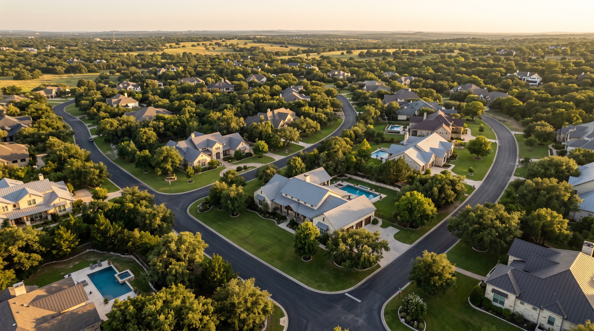 Wooded Woodway-area neighborhood with long concrete driveways leading to homes among mature trees